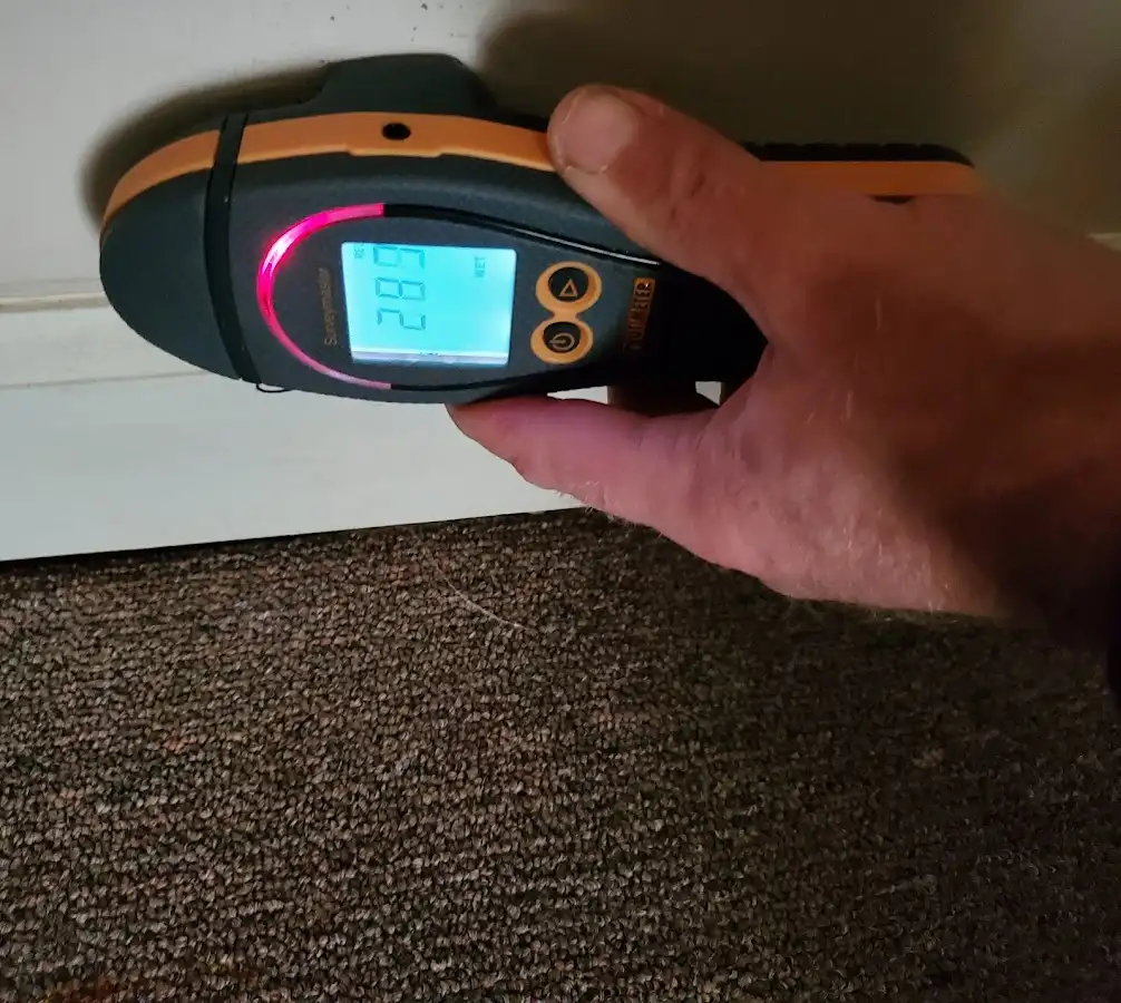 Moisture detection at baseboard during Storm Damage Restoration in Kennett Square